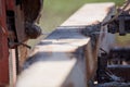 Close up on a saw blade cutting lumber