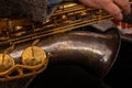 Close-up of a saxophone. Hands playing a saxophone. Musical instruments Royalty Free Stock Photo