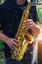 Close up of saxophone player`s hands playing jazz music Royalty Free Stock Photo