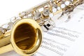 A close up of Saxophone with sheet music