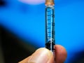 Close up scale of tuberculin syringe and blue background of patients unit in hospital. Royalty Free Stock Photo