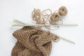 Close up of scarf knitted work with large needles Royalty Free Stock Photo