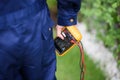 Close-up scene of the electrician holding a multimeter Royalty Free Stock Photo