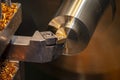 The close-up scene of lathe machine finish cut process the brass shaft material.