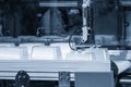 Close up scene material handling process the food container by robotic system from injection machine