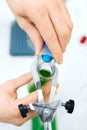 Close up of scientist filling test tubes in lab Royalty Free Stock Photo