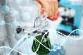 Close up of scientist filling test tubes in lab Royalty Free Stock Photo