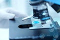 Close up of scientist hand with test sample in lab