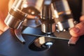 close-up of scientist hands with microscope, examining samples. Royalty Free Stock Photo