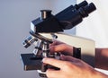 close-up of scientist hands with microscope, examining samples. Royalty Free Stock Photo