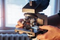 close-up of scientist hands with microscope, examining samples. Royalty Free Stock Photo