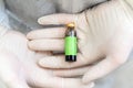 Close up of scientist holding bottle of vaccine developed for corona virus. Covid-19 antidote. Doctor discovers treatment for Royalty Free Stock Photo