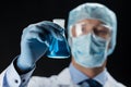 Close up of scientist holding flask with chemical Royalty Free Stock Photo