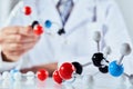 Scientist with coloured molecular structure models Royalty Free Stock Photo