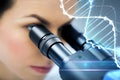 Close up of scientist looking to microscope in lab Royalty Free Stock Photo