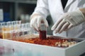 close-up of scientist mixing ingredients in laboratory for new drug