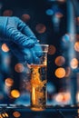 Close-up of a scientist& x27;s gloved hand holding a test tube Royalty Free Stock Photo