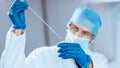 Close up. scientist studying the liquid in a medical flask. Royalty Free Stock Photo