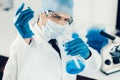 Close up. scientist studying the liquid in a medical flask. Royalty Free Stock Photo