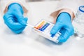 Close up scientist test checks a pH using indicator paper Royalty Free Stock Photo