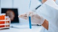 close up. scientist testing test tubes with samples. Royalty Free Stock Photo