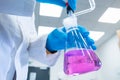 Close up scientist uses a titration method of analysis to study chemical properties of the water sample. Scientist Royalty Free Stock Photo