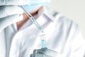 Close up a scientist working in laboratory to analyze blue extracted of a DNA molecules in micro tube , clinical or science