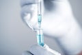 Close up a scientist working in laboratory to analyze blue extracted of a DNA molecules in micro tube , clinical or science