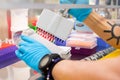 Close-up of a scientists pipetting a solution into 96-well plate