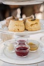 Close up of Scone with clotted cream and jam for Afternoon Tea Set. Royalty Free Stock Photo