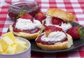 Close up of scones topped with strawberry jam,cream Royalty Free Stock Photo