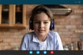 Little boy child in headphones talk on video call