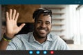 Screen view of smiling biracial man speak on video call