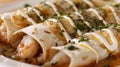 Close-up of scrumptious seafood enchiladas, elegantly dressed with a creamy sauce and sprinkled with parsley and black Royalty Free Stock Photo