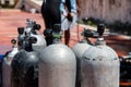 Close-up of scuba diving tanks on a tropical beach in Mexico. In the background the Caribbean Sea. Refueling diving Royalty Free Stock Photo