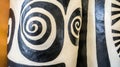 Close-up of sculpted, patterned columns.  Black and white spiral designs on cream-colored forms.  Intricate detailing on Royalty Free Stock Photo