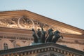 Close up of sculpture of Apollo above the portico of Bolshoi Theatre in Moscow, Russia. Illuminated roof and upper part of russian