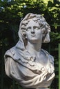 Close-up of sculpture woman\'s head made of white marble. Old statue of sensual sad woman in veil