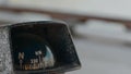 Close up sea compass on navigation bridge in sailing ship. Nautical compass coordinates on captain bridge while sea