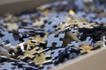 Close-up of a sea of jigsaw puzzles inside a box