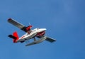 Close up of sea plane with landing floats flying overhead near Copenhagen, Denmark Royalty Free Stock Photo