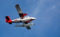 Close up of sea plane with landing floats flying overhead near Copenhagen, Denmark Royalty Free Stock Photo