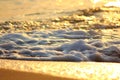 close up sea waves white foam on beach against defocus sea background Royalty Free Stock Photo