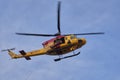 Close-up of Search and Rescue helicopter lifting basket stretcher