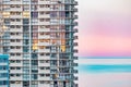 Close up section of high rise seaside apartment building with pink sunset over the beach on the Gold Coast Royalty Free Stock Photo
