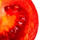 Close-up section of juicy ripe red tomato on white background. Isolated Royalty Free Stock Photo
