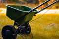 Close-up of a seed spreader in a yard with beautiful bokeh light abstract background and copy space Royalty Free Stock Photo