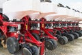 Close up of seeder attached to tractor in field. Agricultural machinery for spring works sowing