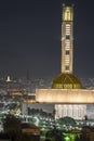 The great mosque of Algiers and the Martyr's Memorial monument Maqam El Chahid by night.