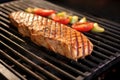 close up of seitan steak grilling on indoor grill